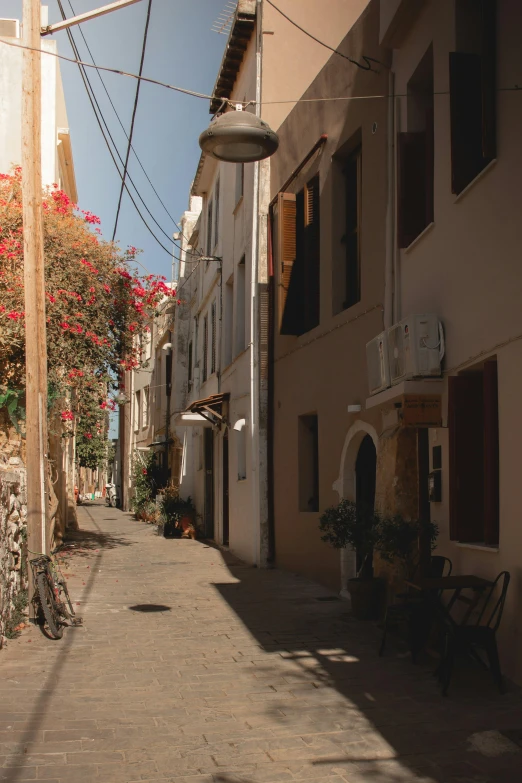 a view down a quiet alley between two buildings