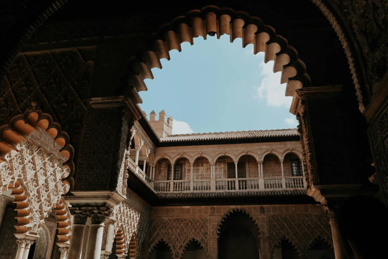 some buildings and arches and a sky background