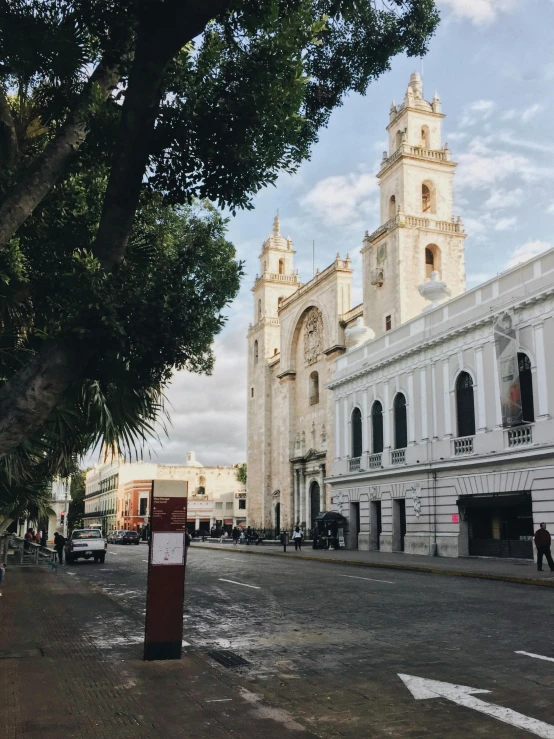 the city's tall church towers rise over a town