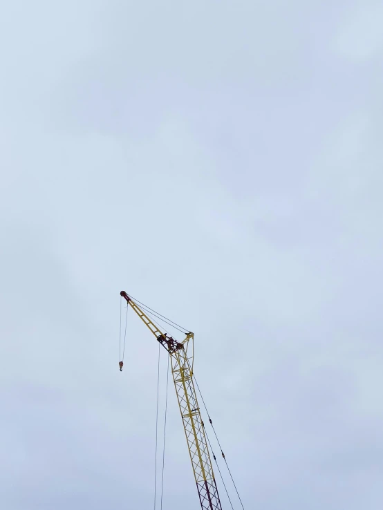 a large crane is on top of a building