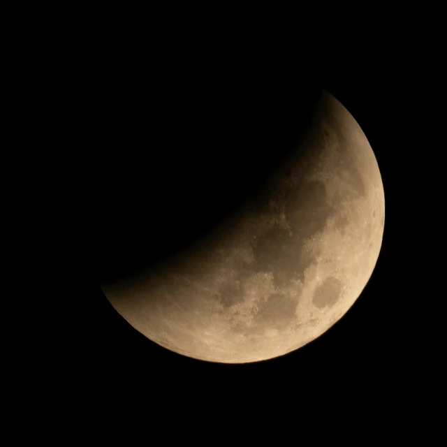 a very high view of a half moon with clouds