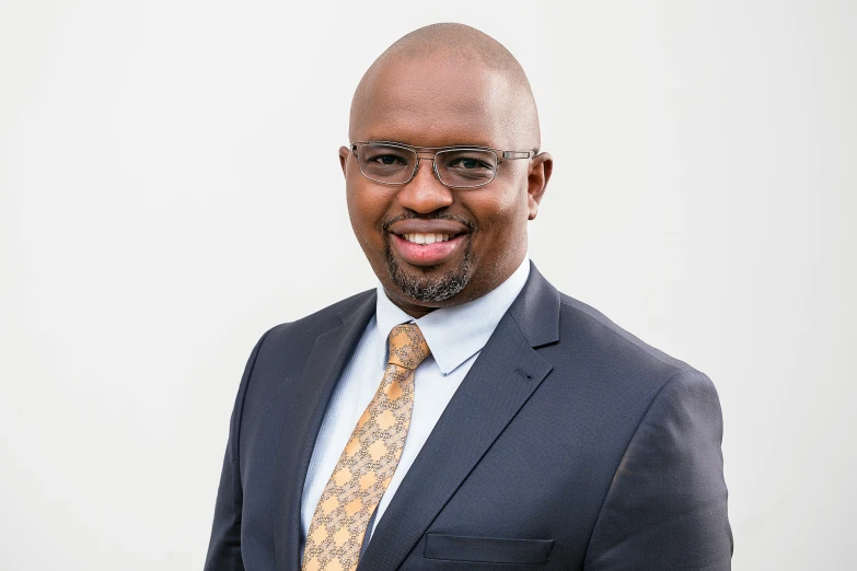 an african american male wearing a business suit