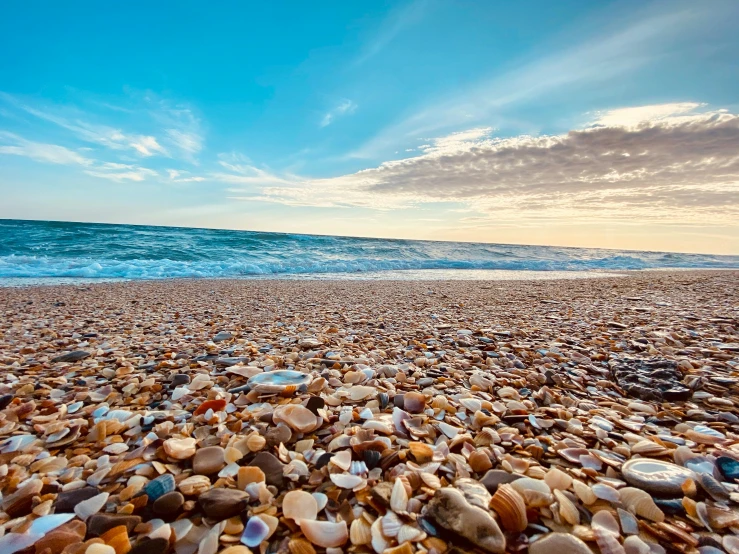 a rocky beach with waves coming in