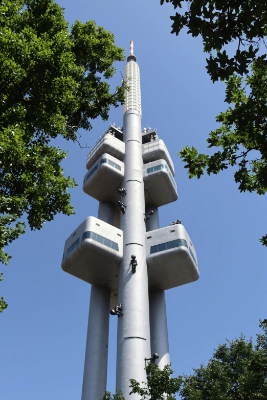 a tall tower with some people climbing up it