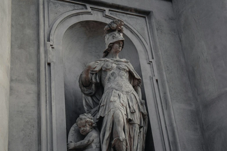 a statue is next to a window and door