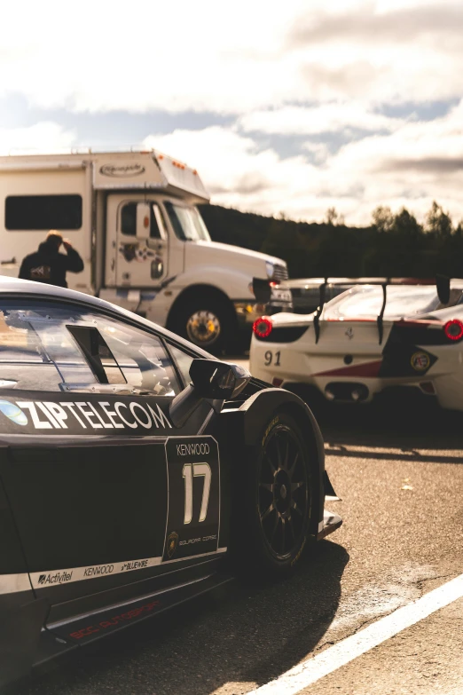 two race cars side by side in front of the other