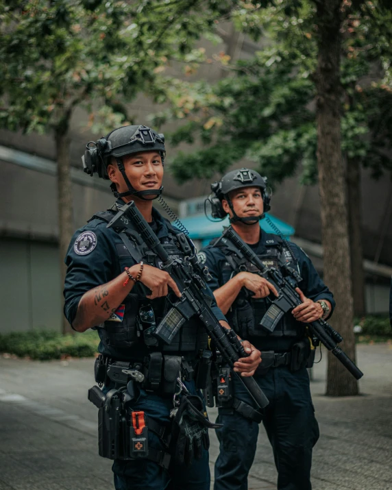 some officers with guns on the side of the road