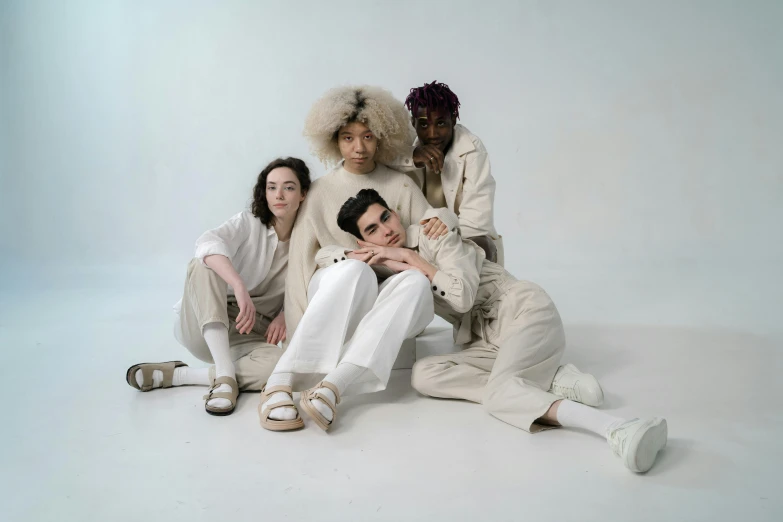 a group of young people dressed in white