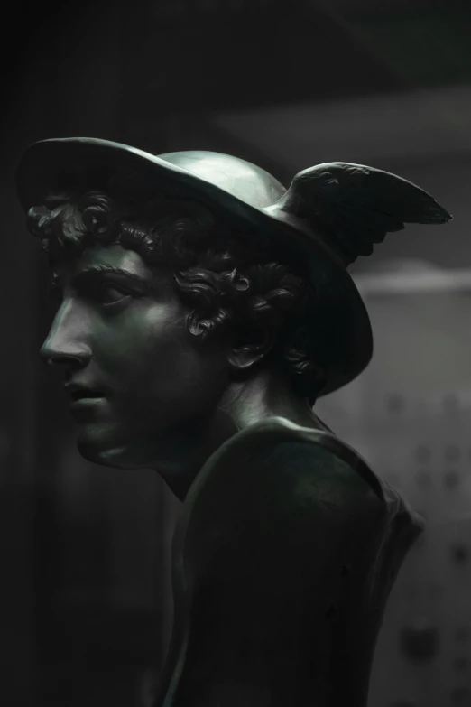 a statue has an angel hat on its head