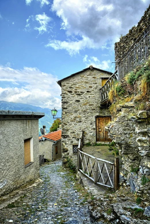 an old stone building on the side of the road