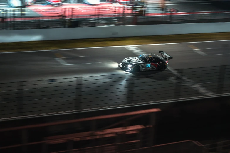 a racer speeding at night on his motorcycle