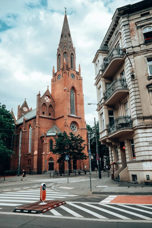 a church steeple stands in the middle of the street