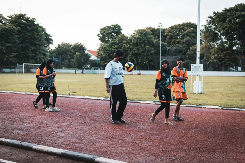 the children are playing with a soccer ball