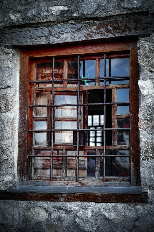 old window in an abandoned stone building