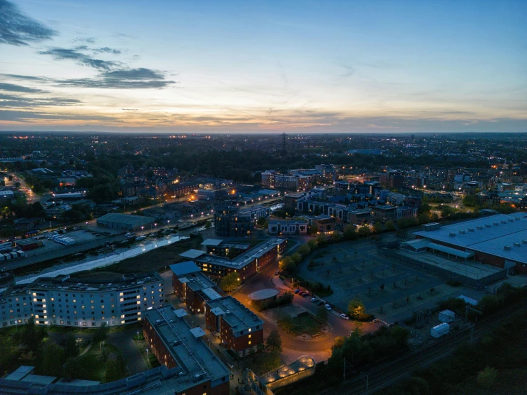 an aerial view of a city at dusk