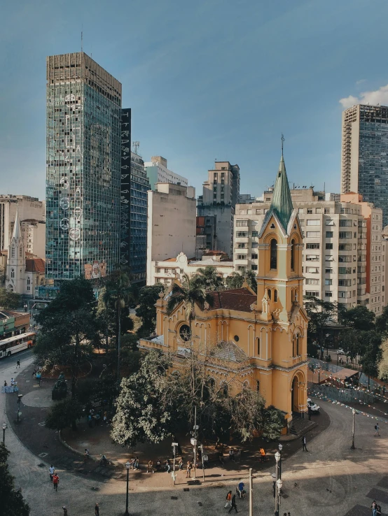 a cathedral stands in the middle of a large city