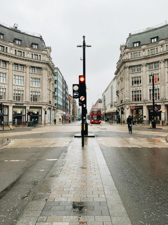 a street with a traffic light and a few buildings