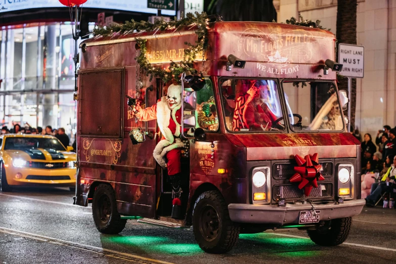 the clown is in the back of a truck with presents