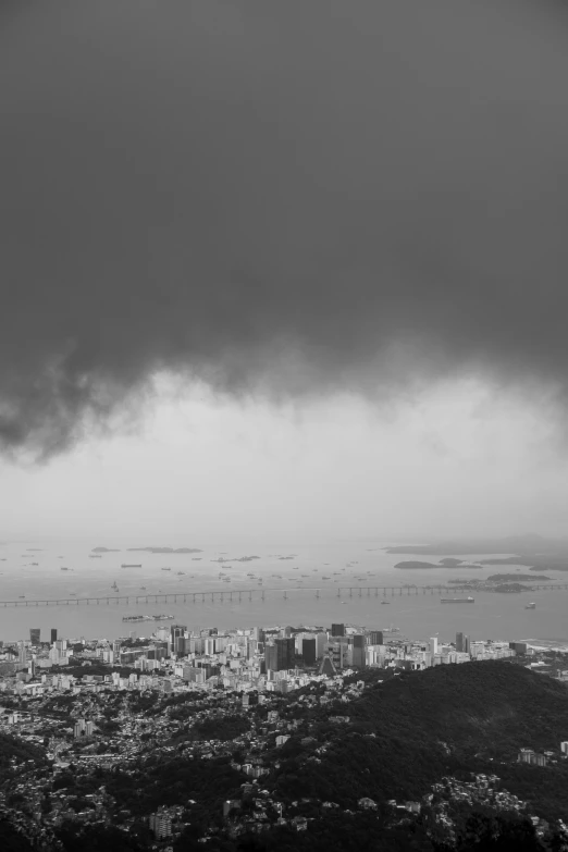 a cloudy sky above the city with lots of water