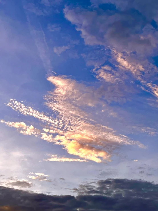 the sky at night with a kite flying high in the clouds