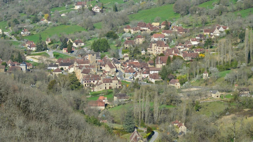 a mountain area with several houses perched high on the hillside