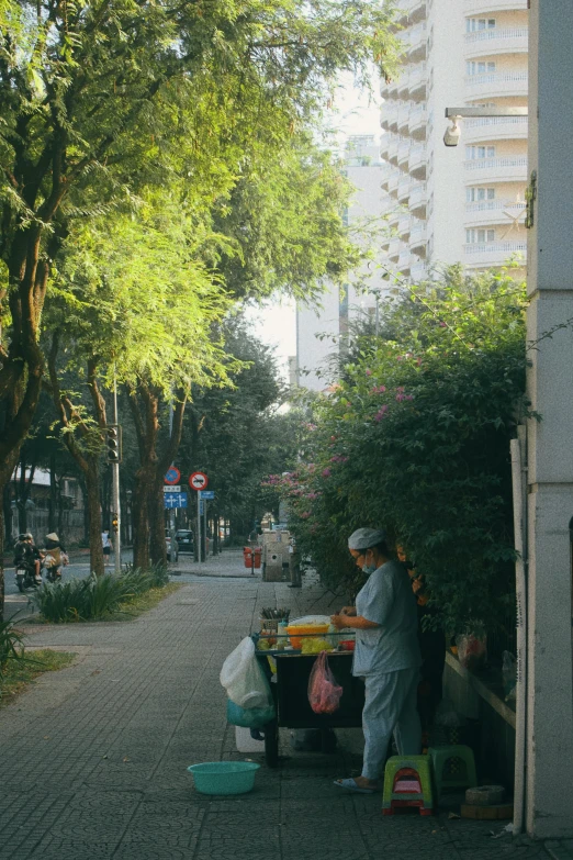 a woman at a table with food and shopping bags