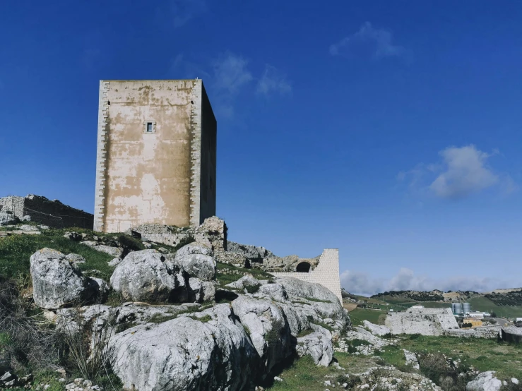 an image of some rocks and a tower