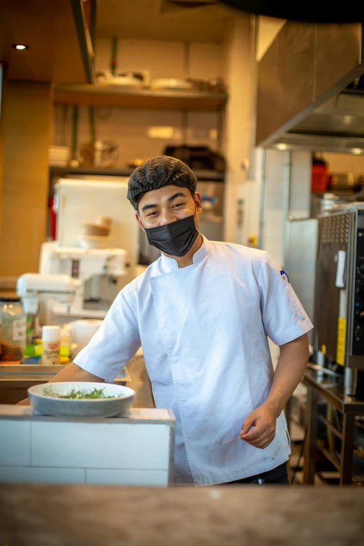 a man with a black mask wearing a black face cover