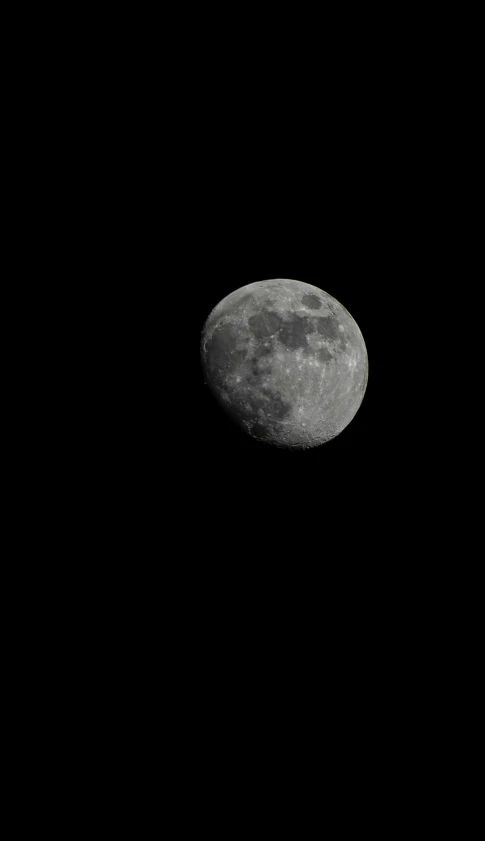 a jet flying low over the moon at night