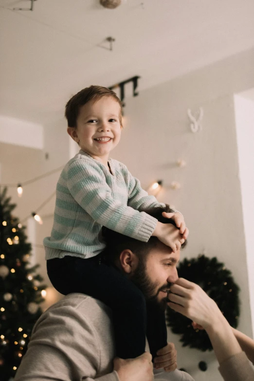 a father and son are in the living room