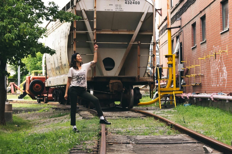 a woman holding onto a white dump truck