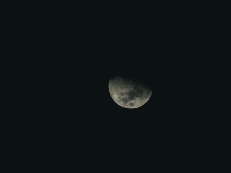 a black and white po of the moon taken from an airplane