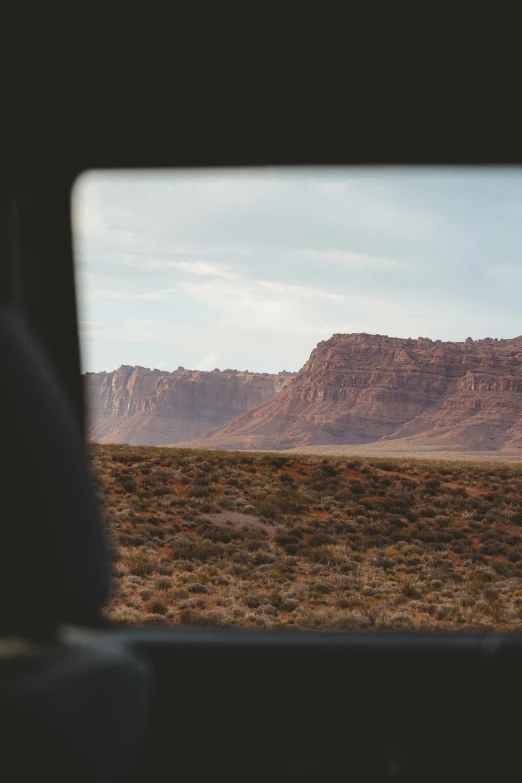 a bus traveling down a desert highway