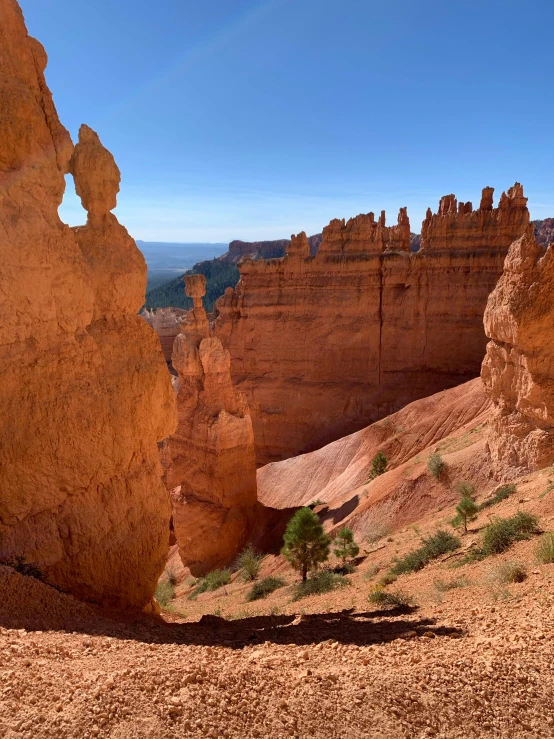 a person stands alone in the desert looking at soing