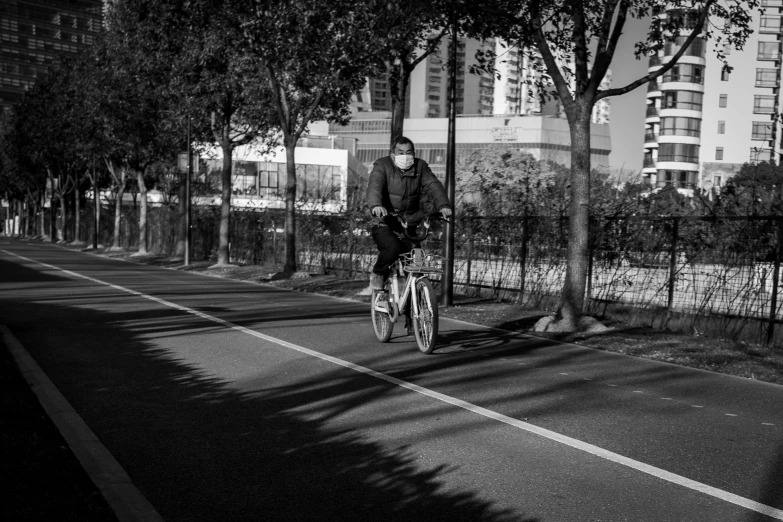 a person rides a bike down a path