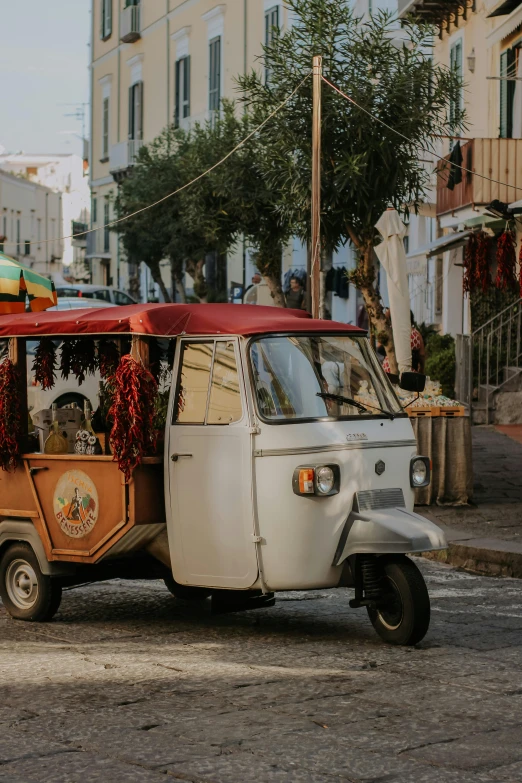 the small van has an orange roof