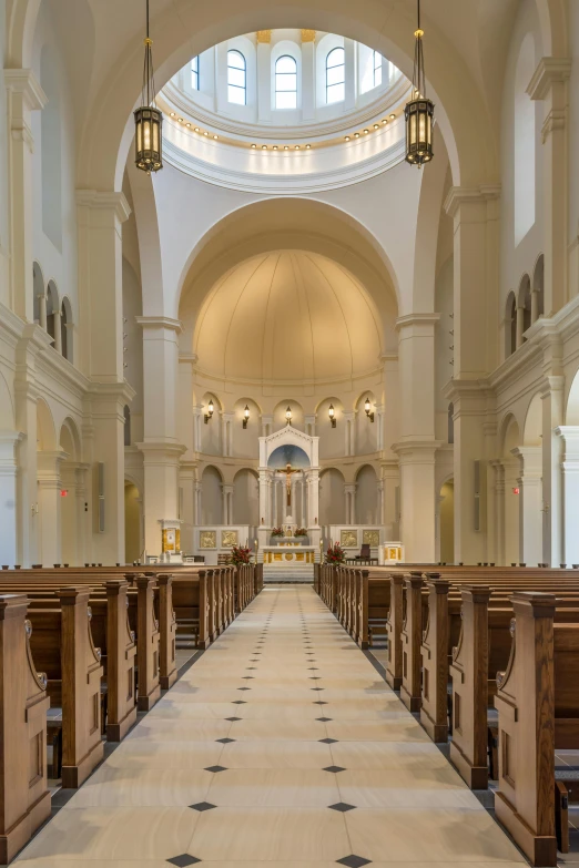 a view of an old church's pews from the first floor