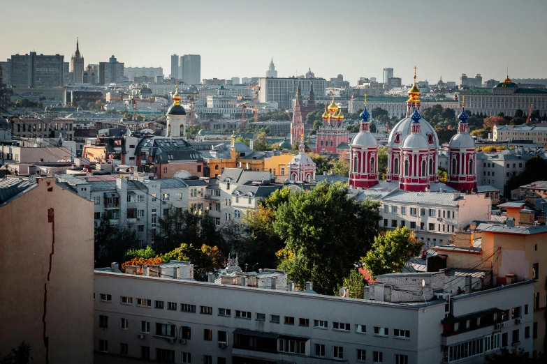 view of city buildings from the rooftop of a building