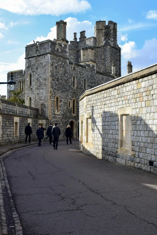 the city street is next to the very old buildings