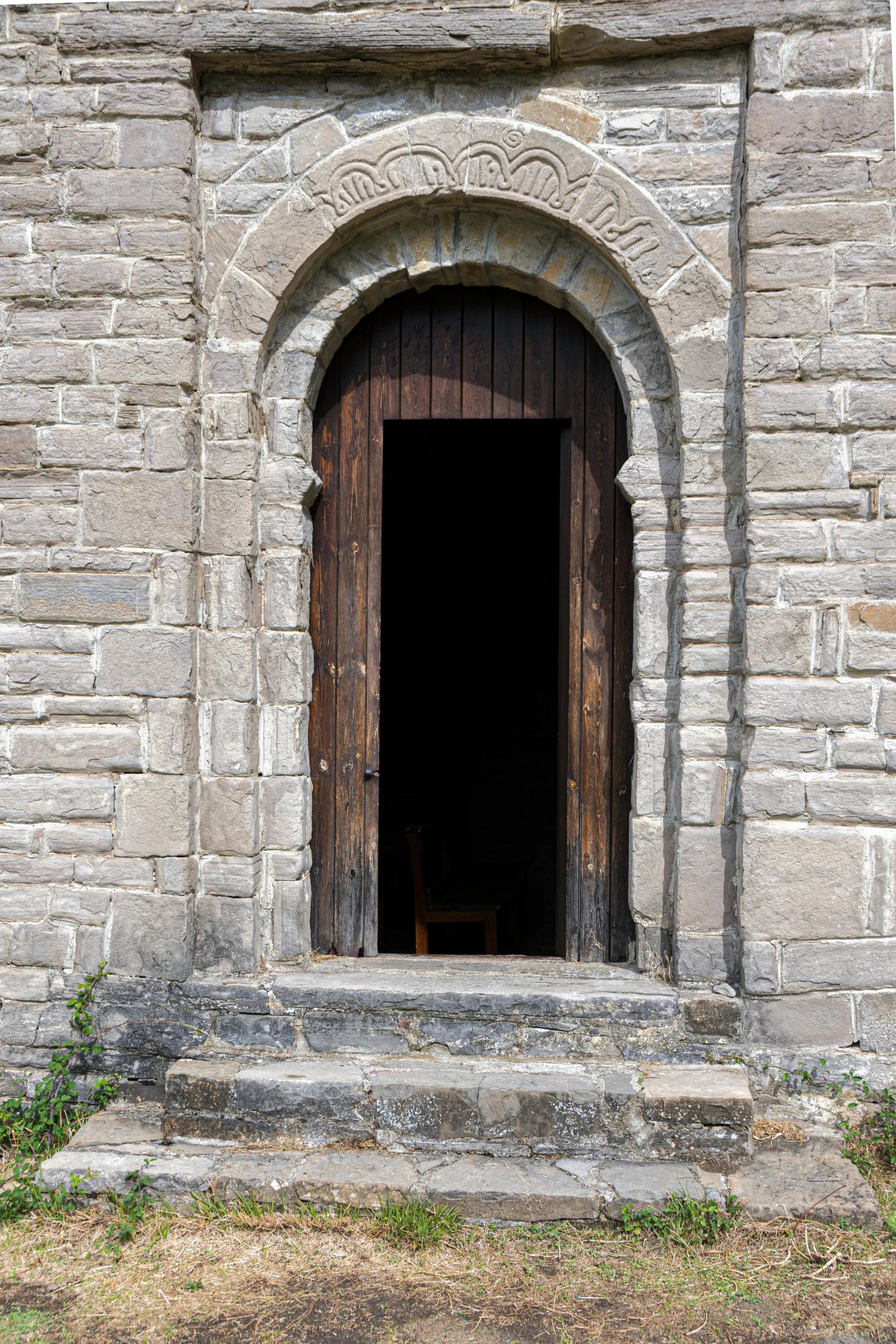 doorway to an old castle like building with stonework