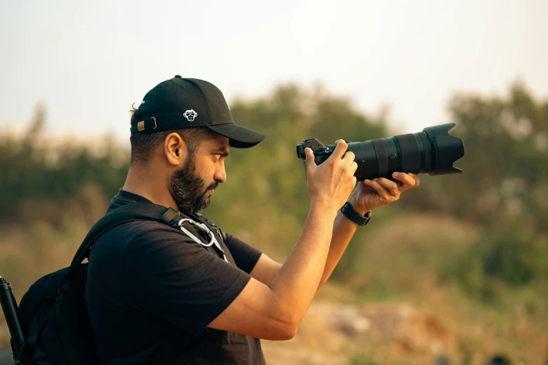 a man taking pictures with his camera while taking a po