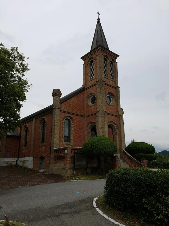 an old church with its tower made of red bricks