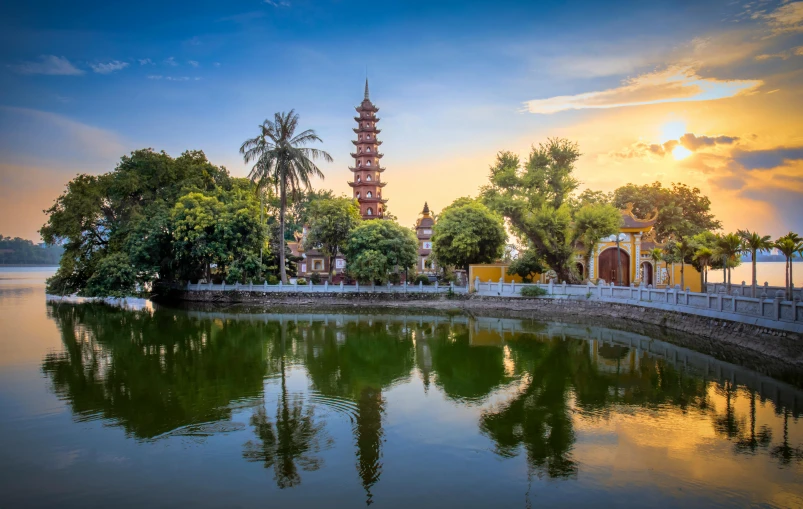 a beautiful view of a temple on the water's edge