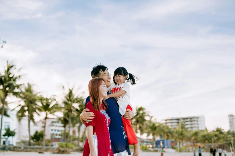 a man with two women holding a small child