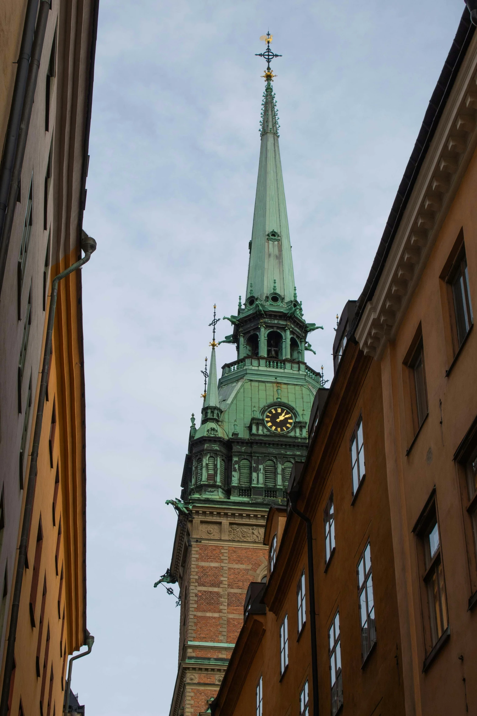 a very tall steeple towering over a city