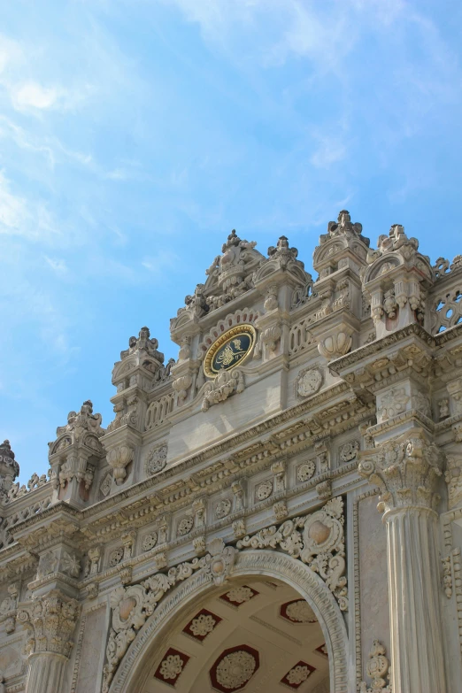 a white clock sitting on top of a big building