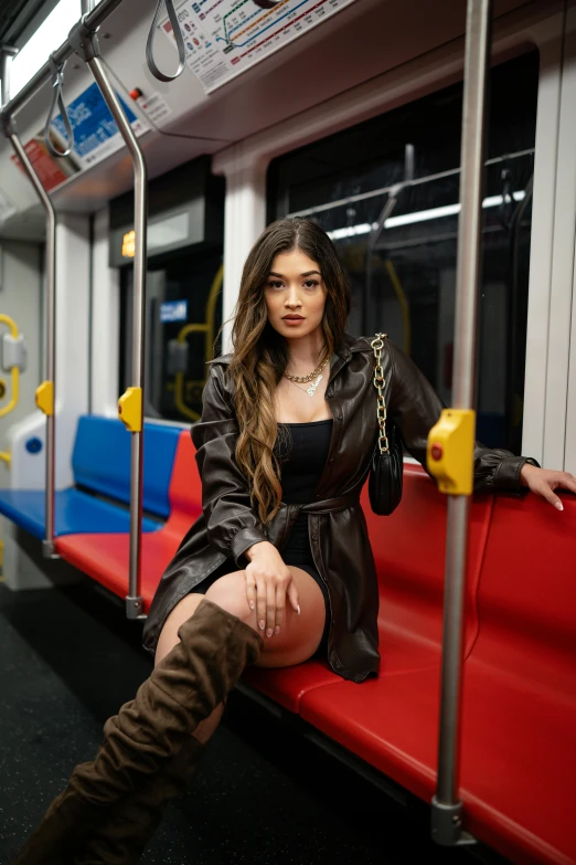 a woman posing with her hands on a rail