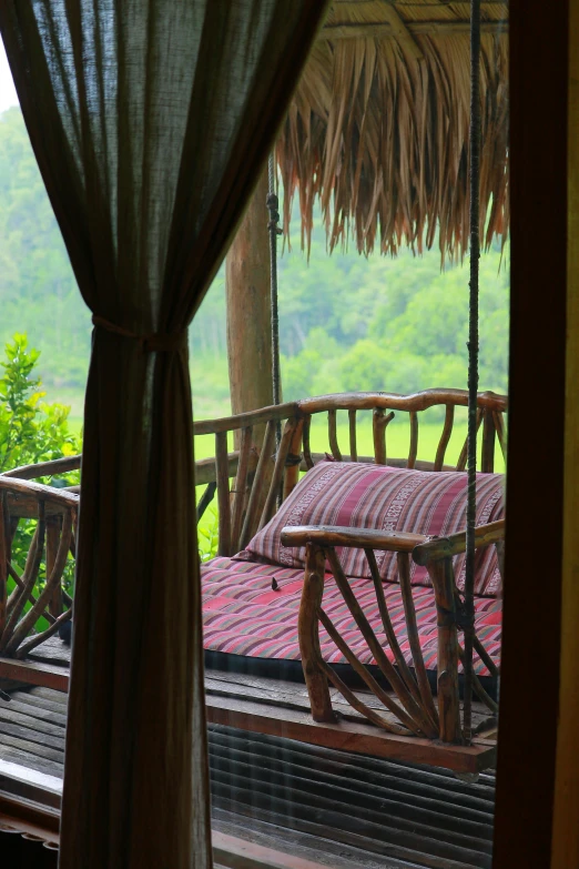 an outdoor area with wood and wicker furniture