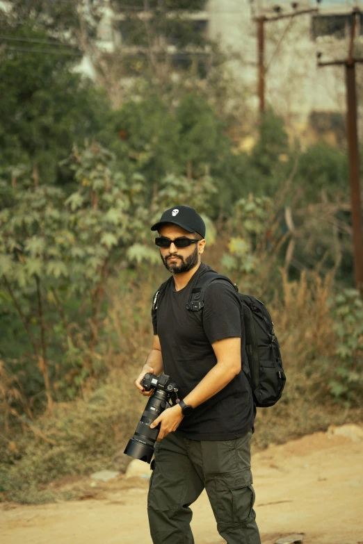 a man riding skateboard while holding a camera