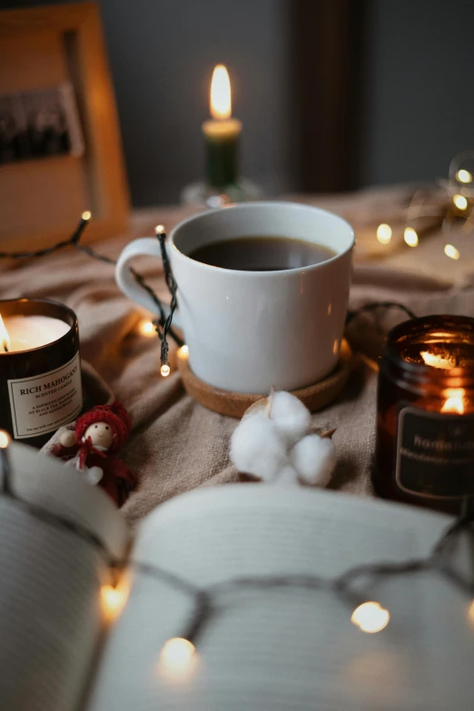 a close up of a table with candle lights and food